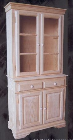 a wooden china cabinet with glass doors on the front and bottom shelves, in white wood