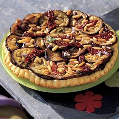 a pie sitting on top of a green plate