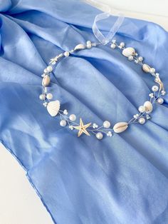 Ocean Dreams Wedding Hair Accessories. Capture the essence of the ocean with this stunning set of white seashell pearls and starfish wedding hair accessories. The delicate vine and hair pins are adorned with shimmering pearls, natural seashells, and charming starfish, creating a truly enchanting look. Perfect for beach weddings, mermaid-inspired themes, or any occasion where you want to add a touch of coastal elegance. Embrace the beauty of the ocean and create a truly unforgettable look with th Sea Shell Wedding Decor, Beach Wedding Hair Accessories, Beach Wedding Accessories, Starfish Wedding, Seashell Wedding, Hair Wreaths, Beach Wedding Hair, Mermaid Inspired, Bridal Hair Vine