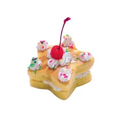 a piece of cake with sprinkles and a cherry on top is shown