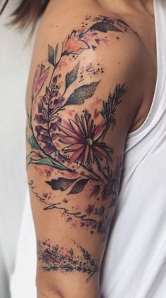 a woman with a flower tattoo on her arm