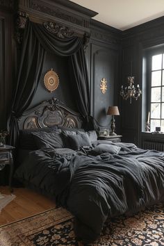 a large bed sitting next to a window in a dark colored room with black curtains