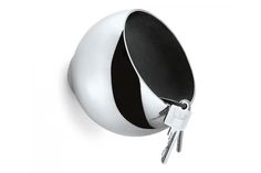 a white and black ball shaped key holder