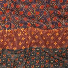 an orange and blue cloth with flowers on it