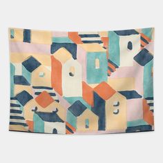 a multicolored wall hanging with an abstract pattern on the front and back of it