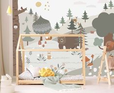 a child's room with a bear themed wallpaper