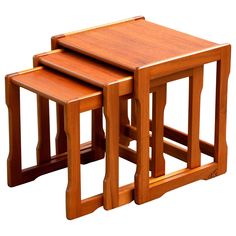 three wooden tables sitting on top of each other