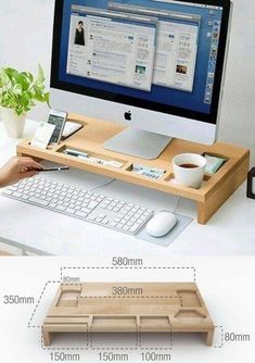 the computer desk is made out of wood and has an attached keyboard, mouse pad, and