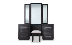 a black vanity with mirror and stool next to it