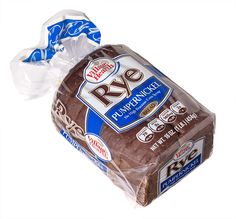 a loaf of rye bread wrapped in plastic