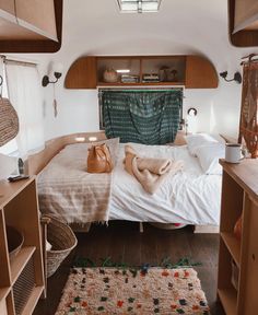 a bed sitting inside of a bedroom on top of a wooden floor