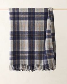 a plaid blanket hanging on a clothes line