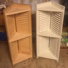 two wooden shelves sitting next to each other