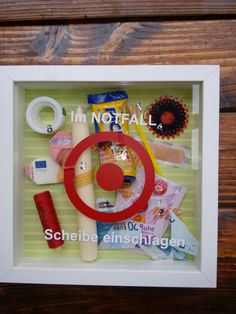 an image of a display in a white frame with red circles and other items on it