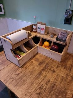 a kitchen counter with an open drawer on the top and two rolls of toilet paper in it