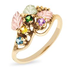 Celebrate Mom’s love for family with this exquisite customized ring from Black Hills Gold. Crafted in warm 10K gold, this ornate look showcases the two to six 2.5mm birthstones of your choice artfully set along a vine adorned with 12K green and rose gold leaf accents. Buffed to a brilliant luster, this ring captures her elegance. Black Hills Gold jewelry is manufactured in the Black Hills of South Dakota and keeps the traditional style from the 1870s of grape leaves, grape clusters and vines in the designs. Each item comes with a certificate of authenticity and is guaranteed against defects in workmanship. Gold Heirloom Birthstone Ring With Gemstone Accents, Heirloom Gold Birthstone Ring With Gemstone Accents, Black Hills Gold Rings, Rose Gold Leaf, Black Hills Gold Jewelry, Swirl Ring, Celebrate Mom, Black Hills Gold, Black Hills