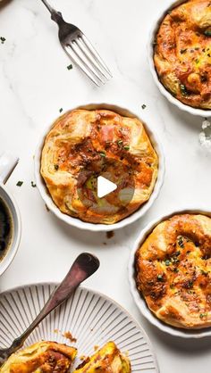 four different types of pies on plates with forks and spoons next to them