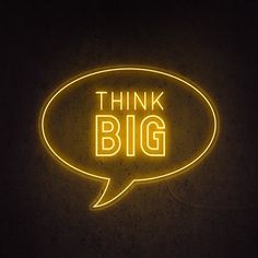 a neon sign that says think big in a speech bubble with the words think big below it