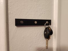 there is a key hanging on the wall