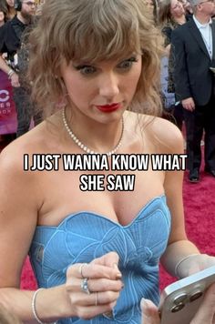 taylor swift on the red carpet at the oscars wearing a blue strapless dress