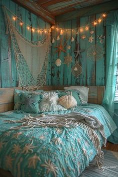 a bed room with a neatly made bed and string lights