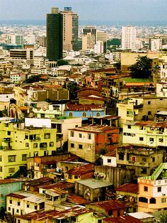 an aerial view of a city with tall buildings