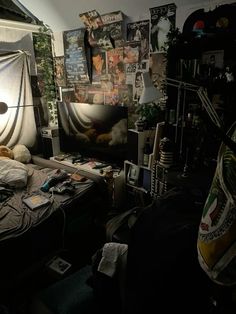 a bed room with a neatly made bed and lots of clutter