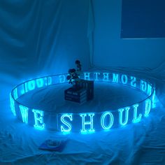 a lighted sign that reads, we should be something you love to see in the dark