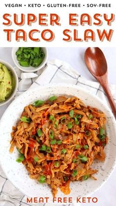 a white plate topped with meat and veggies next to a bowl of guacamole