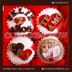 the cupcakes are decorated with hearts and letters