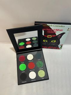 traditional christmas eye palette popped w/ duochromes to make this the cutest christmas palette  tinsel metalic red snowman shify white gold elves matte green  lights neon green matte Memories matte red eggnog  parkly green prezzies black matte baubles white matte Star soarkly lime green s Christmas Palette, Green Lights, Matte Eyeshadow Palette, Matte Green, Matte Red, Eye Shadows, Matte Eyeshadow, Christmas Cat