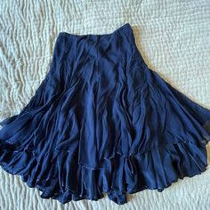 Calypso St. Barth ~ Christiane Celle Ruffled Renaissance Boho Fairy Skirt Midnight Blue Navy Vintage From 2000s 100% Silk Size 8 Nwot A Classy Skirt That Features Delicate Ruffles In Midnight Blue Silk Chiffon That Is Weightless And Absolutely Ethereal. The Color Is Sophisticated Deep Navy Blue That Can Be Worn To The Office With The Blue Calypso Button-Down I Have Listed Or A Comfy Tee For Weekend Brunch. It Fits Flat At The Waist And Then Flares Out At The Skirt. Beneath The First Ruffle Layer Blue Skirt Long, Blue Calypso, Blue Cottagecore, Classy Skirts, Fairy Skirt, Cottagecore Outfits, Boho Fairy, Deep Navy Blue, Calypso St Barth