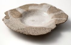 a white and gray bowl sitting on top of a table