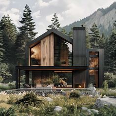 a house in the woods surrounded by rocks and trees with mountains in the back ground