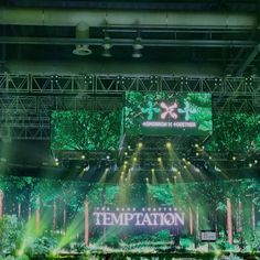 the stage is lit up with green lights