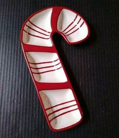 a red and white object sitting on top of a table