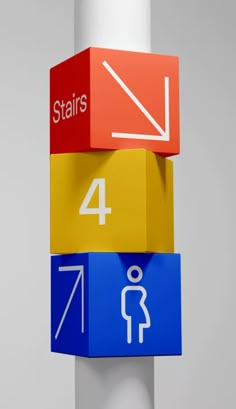 three different colored blocks with numbers and symbols on them