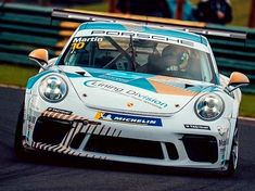 a porsche racing car driving on a race track