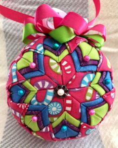 a colorful ornament with a bow on it