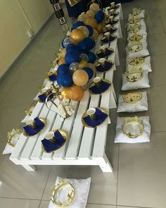 a long table with blue and gold decorations