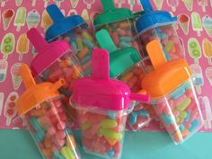 small plastic containers filled with candy and candies