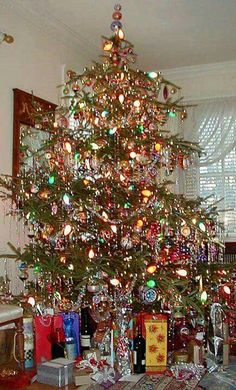 a decorated christmas tree in a living room