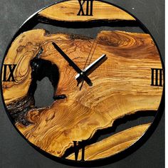 a clock made out of wood with roman numerals