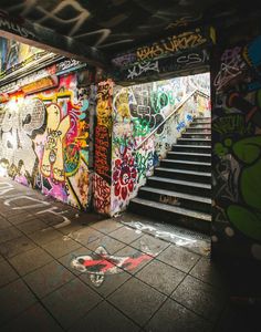 the stairs are covered with graffiti and spray paint