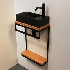 a bathroom with a sink and shelf on the wall