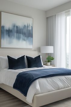 Transform Your Bedroom: Elegant Blue & White Decor Ideas Navy White Home Decor, White Bed Navy Accents, Black White Grey Blue Bedroom, White Blue Black Bedroom, Navy Blue Interior Design Bedroom, Navy Home Accents, Blue And White Interior Design Modern, Navy Gold White Bedroom, Navy Blue Accent Bedroom