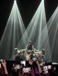 a group of people standing on top of a stage