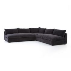 a black sectional couch on a white background