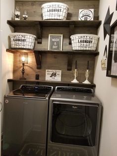 a washer and dryer in a laundry room with baskets on the shelves above