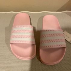 Brand New Women Adidas Light Pink And White Three Striped Adilette Slides Adidas Non-slip Summer Slides, Summer Adidas Slides, Adidas Summer Slide Flip Flops, Adidas Summer Flip Flops, Adidas Slide Flip Flops For Summer, Casual Adidas Flip Flops For Spring, Adidas Casual Slides For Spring, Sporty Open Toe Slides For Spring, Adidas Synthetic Slide Sandals